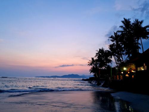 Anom-Mendira-beach-Candidasa-Bali-sunset